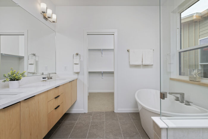 Bathroom with freestanding tub walk in shower and walk in closet